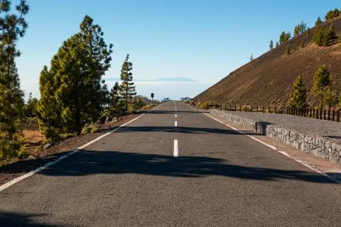 Road over clouds on Teide mountains in Tenerife, Canary Islands Stock Photos