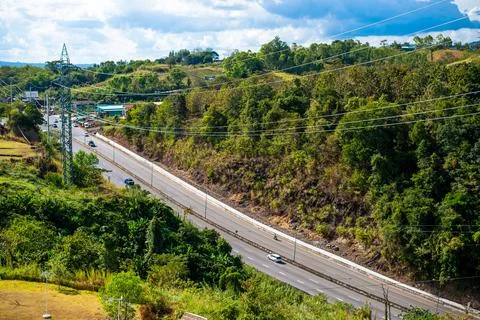 The road passes between the valleys. In the midst of beautiful nature Forests Stock Photos
