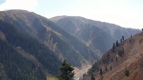 A road passing through a hilly area Stock-Footage 251540884