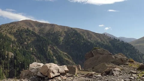 A road passing through a hilly area Stock-Footage 251540891