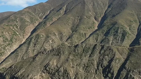 A road passing through a hilly area Stock-Footage 251540901