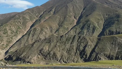 A road passing through a hilly area Stock-Footage 251540933