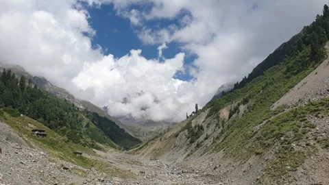 A road passing through a hilly area Stock-Footage 251540937