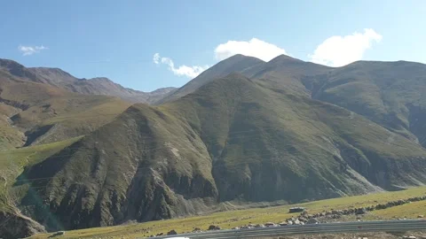 A road passing through a hilly area Stock-Footage 251540946