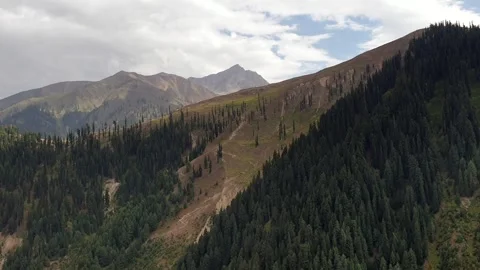 A road passing through a hilly area Stock-Footage 251540967