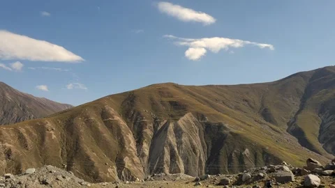 A road passing through a hilly area Stock-Footage 251540975