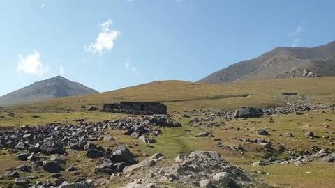 A road passing through a hilly area Stock-Footage 251540977