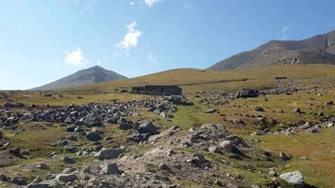 A road passing through a hilly area Stock-Footage 251540981