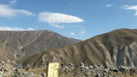 A road passing through a hilly area Stock-Footage 251540999