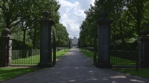 Road passing through an open gate Stock Footage 73701909