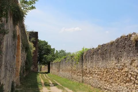 Road path in-between walls Stock Photos