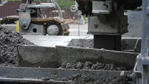 Road paver finisher spreading layer of asphalt concrete over roadway base Video stock 158049435