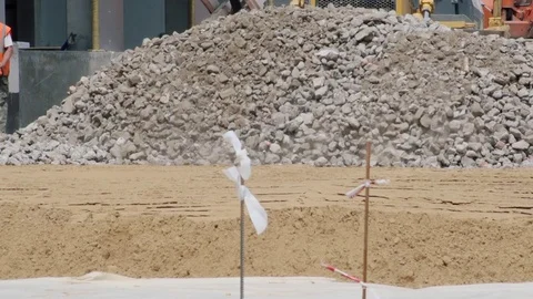 Road paving. The tractor constructs the road. Stockbeeldmateriaal 72533575