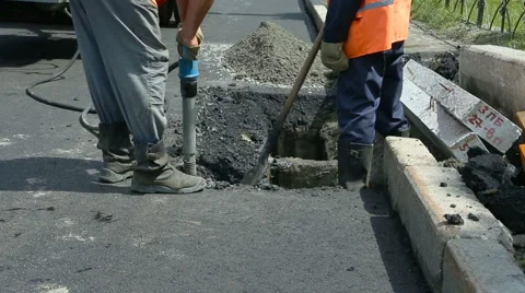Road Paving. Workers laying stone mastic asphalt during street repairing work Stock Footage 65255946