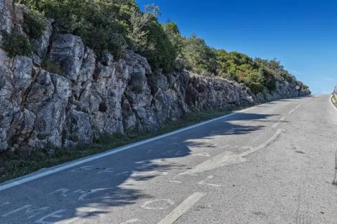 Road in the pebble of the arrabida with cliff. Stock Photos