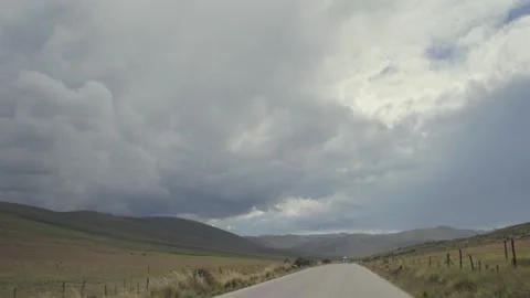A road in the Peruvian Andes with thick clouds on the horizon. Stock Footage 338000830