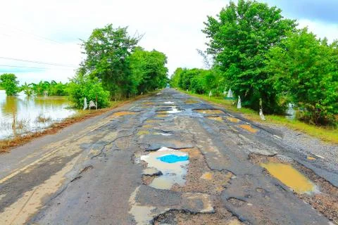 Road with potholes . Stock Photos