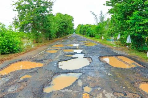 Road with potholes . Stock Photos