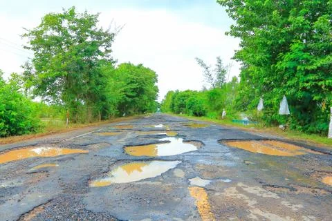 Road with potholes . Stock Photos
