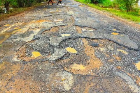 Road with potholes . Stock Photos