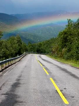 Road with the rainbow Stock Photos