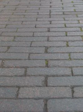 Road with rectangular, uniform sidewalk for the background 写真素材