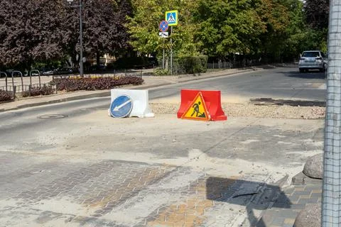 Road repair caution work in progress sign Stock Photos