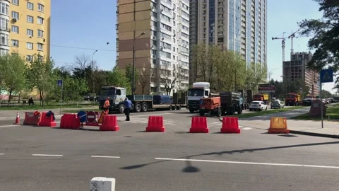Road repair at the intersection, there are road blocks,pedestrian crosses road 스톡 동영상 130916292