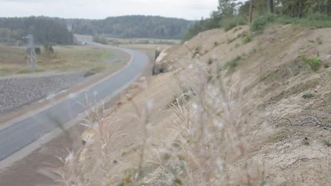 Road, rock slopes, trees along the road Stock Footage 275333532