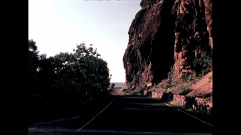 Road by Rocky Cliff Stock Footage 278216842