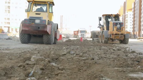 Road-roller and grader working at construction site Stock Footage 88908424