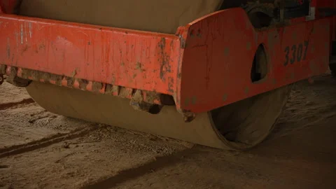 Road roller compacting soil at construction site Stock Footage 314969165