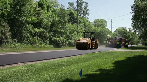 Road roller compressing newly laid asphalt Stock Footage 39411020