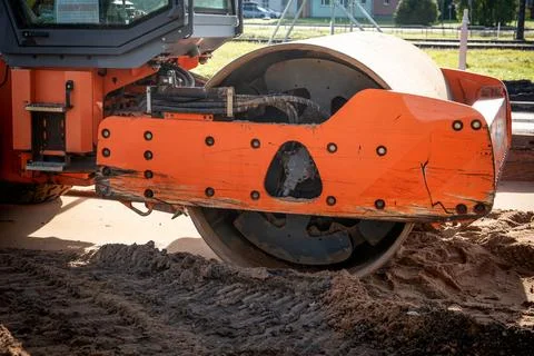 Road roller at construction site. Construction equipment and road construction Stock Photos