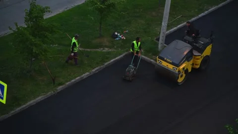 Road roller drives on asphalt Stock Footage 242357090