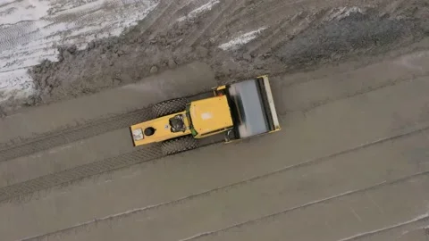 A road roller is driving on a construction site. Stock Footage 153469345