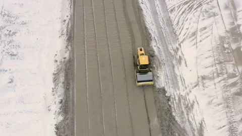 A road roller is driving on a construction site. Stock Footage 153469406