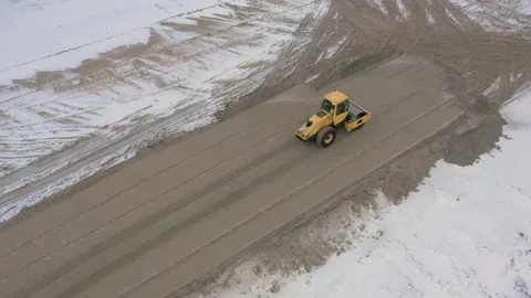 A road roller is driving on a construction site. Stock Footage 154202494