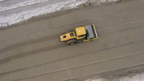 A road roller is driving on a construction site. Stock Footage 155189058