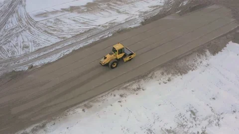 A road roller is driving on a construction site. Stock Footage 155558761