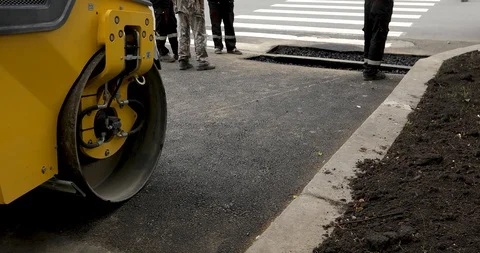 Road with roller machine and pedestrian lane Stock Footage 112600587