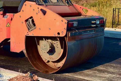 Road roller makes the paving. Stock Photos