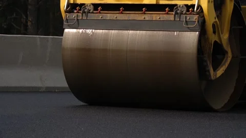 Road roller making motorway surface even and smooth Stock Footage 158049158