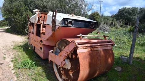 Road roller, old rusty abandoned steamroller Stock Footage 106263421