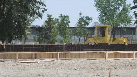 Road roller passes and flattens road during reconstruction. Stock Footage