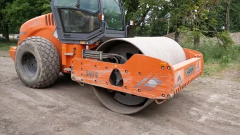 Road roller rides on construction site. Russia, Stavropol, 10.06.20 Stock-Footage 144243777