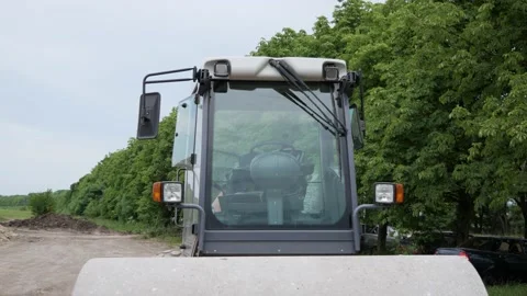 Road roller rides on construction site. Vibratory soil compactor. Industrial Stock Footage 144244555