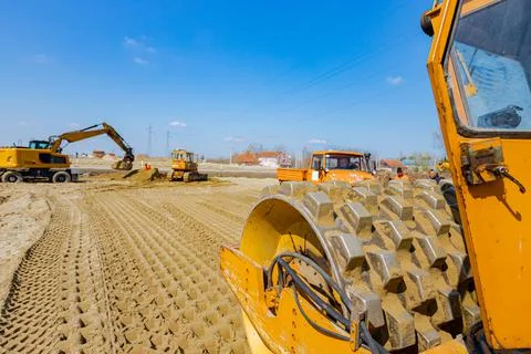 Road roller with spikes is working at construction site Stock Photos
