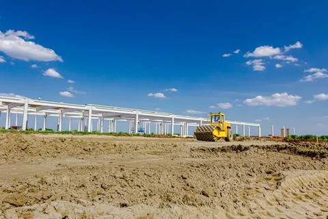 Road roller with spikes is working at construction site Stock Photos