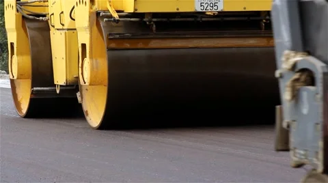Road roller. Steamroller smoothing asphalt. Asphalting. Paving. Close up. Stock Footage 41727939